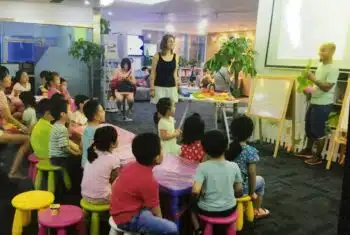 Teacher leading discussion with teenage ESL students in China