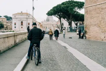 man on bike in rome
