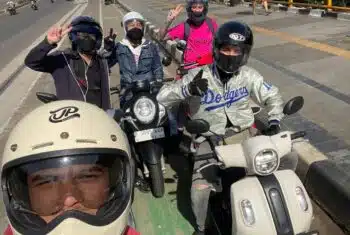 Teachers on motorbikes in Jakarta, Indonesia