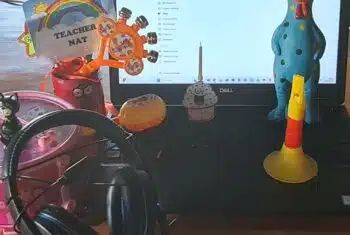 Online teacher Natalie's laptop with lessons props