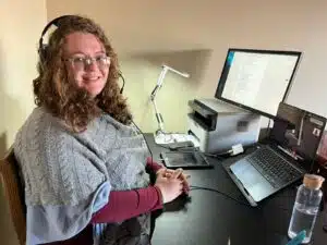 Teacher Vanessa at her desk, teaching English online