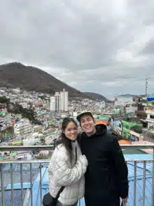 Matt and Perlie posing on a bridge in Busan