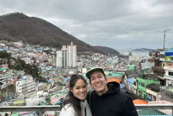 Matt and Perlie posing on a bridge in Busan