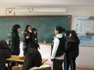 Korean students doing a speaking activity in a South Korean classroom
