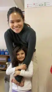 Teacher Perlie hugging a Turkish student