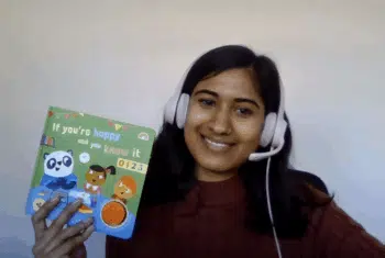Teacher Tasmika holding some teaching resources